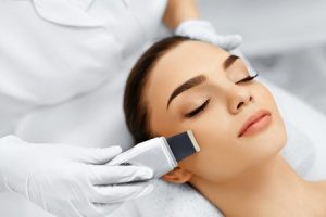 48892703 - skin care. close-up of beautiful woman receiving ultrasound cavitation facial peeling. ultrasonic skin cleansing procedure. beauty treatment. cosmetology. beauty spa salon.